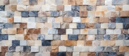 A detailed close-up of a wall built using various colored stone tiles