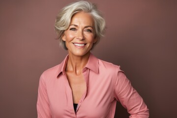 Portrait of a beautiful senior business woman smiling and looking at camera