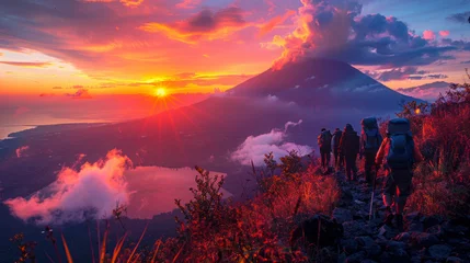 Abwaschbare Fototapete People climb a mountain peak at dawn © Сергей Шипулин