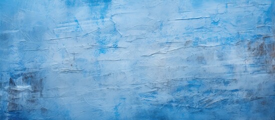 An intense focus on a painting in shades of blue against a plain white backdrop