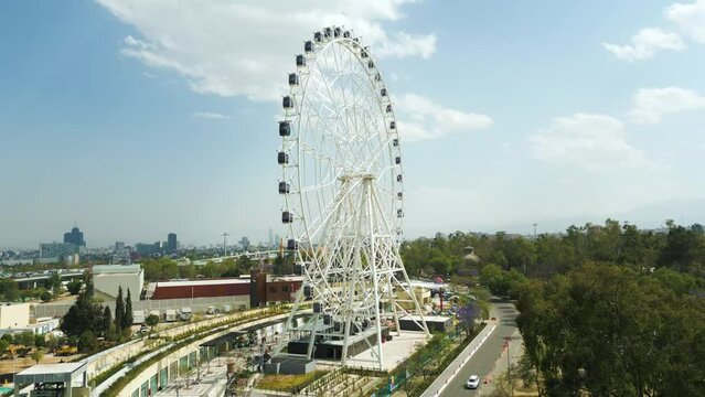 Aerial view rising up in rollercoaster Aztl&aacute;n urban park in Chapultepec, Mexico City, chapultepec