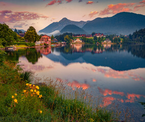 Superb summer sunrise on Grundlsee lake at June. Calm morning scene of Grundlsee village, Liezen District of Styria, Austria, Europe. Beauty of countryside concept background.