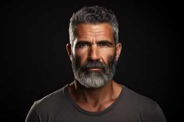 Portrait of a handsome bearded man on a dark background. Men's beauty, fashion. - obrazy, fototapety, plakaty