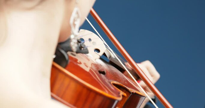 Bare shoulders, blonde head, concert dress, skilled performance