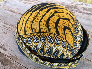 Blangkon is a traditional head covering or hat from Java, Indonesia, worn by men. Blangkon is made from cloth or Batik motifs.