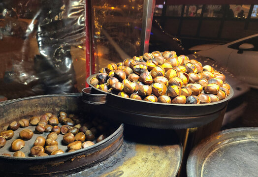 Roasted chestnuts tray on a street vendor stall