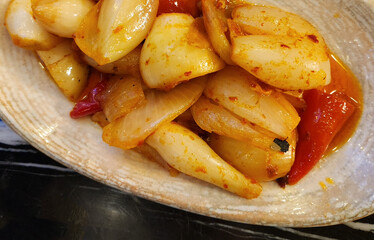 Grilled onion salad served as an appetizer at meals in the middle east countries