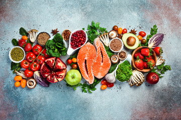 Balanced diet food background. Healthy food clean eating concept. Fish, nuts, fruits and...