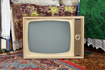 Old vintage TV in a rustic interior.