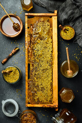 Beekeeping products. Honey in honeycombs, bee pollen, and honey. Top view.