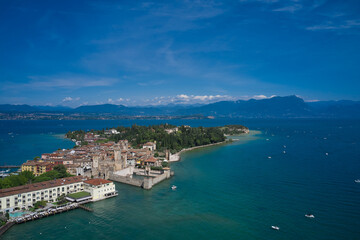 Sirmione, Lake Garda, Italy. Unique aerial view of the central city of Sirmione. In the summer season. Blue water of the lake