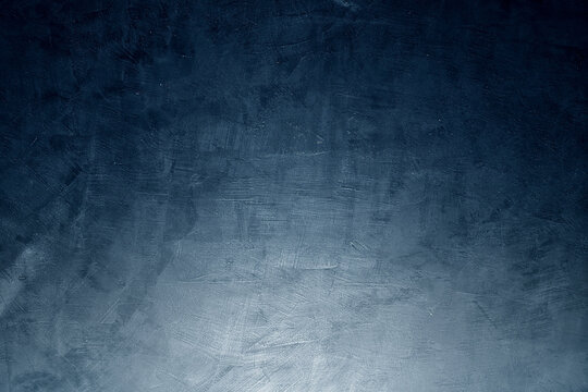 Ombre midnight blue concrete wall background.