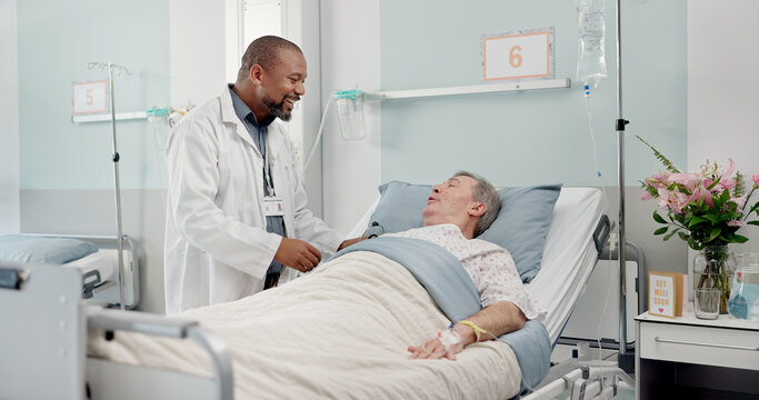Consultation, healthcare and doctor with senior man in hospital after surgery, treatment or procedure. Discussion, checkup and African male medical worker talk to patient in clinic bed for diagnosis.