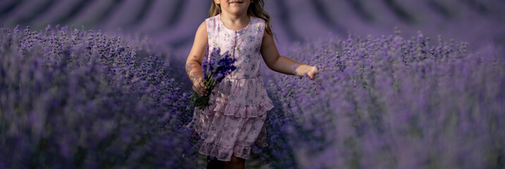 Lavender field girl. happy girl in pink dress in a lilac field of lavender. Aromatherapy concept,...