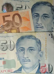 Fototapeten Singapore - Singapore dollars and Euro's. © Richard