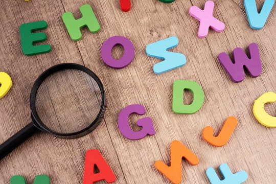 Alphabet with a magnifying glasses