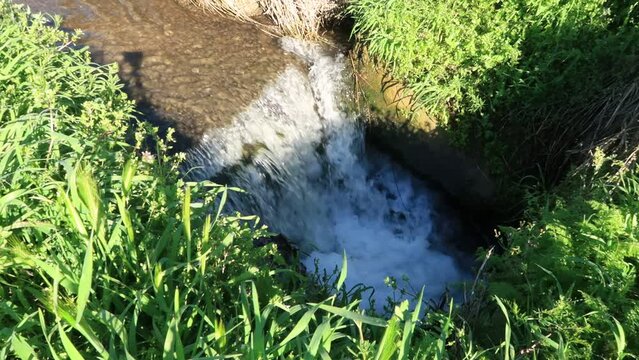 Ditch moat waterfall view peak grass banks