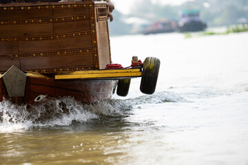 Old car tires recycled into boat fenders foe Impact protection  in Thailand - obrazy, fototapety, plakaty