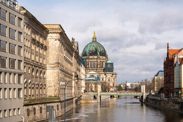 The river flows along the ancient houses of the European city of Berlin. Ancient houses and river...