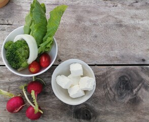 Fresh vegetable salad red radish and cheese in the bowl
