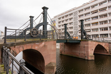 An ancient drawbridge across the river in Berlin. Close-up of the old drawbridge.