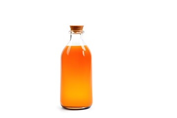 Glass bottle with orange liquid on a white background