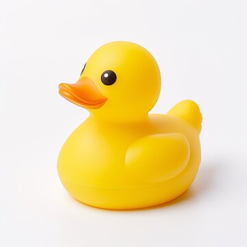 A yellow rubber duck bath toy on a clean white surface