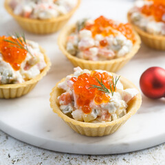 Traditional Russian salad with red caviar