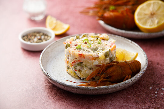 Traditional Russian salad with crawfish