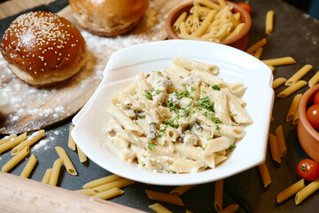 Plateful of Pasta and Hamburger on Table