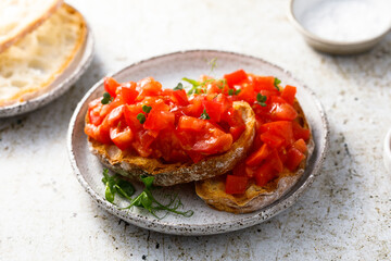 Traditional tomato bruschetta with greens