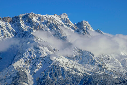 Snowcapped Hochkoenig at Berchtesgaden Alps with clouds, Dienten Mountains, Salzburg, Austria