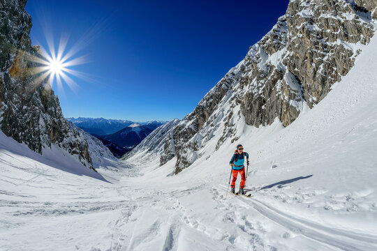 Woman back country skiing on Gruensteinscharte at Grunstein, Mieming Range, Tyrol, Austria