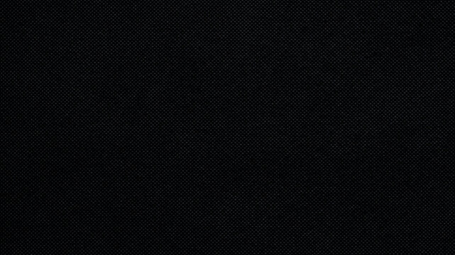 Gloomy background of uniform black color with textured effect. Seamless background texture.