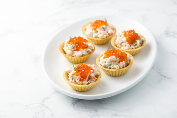 Traditional Russian salad with red caviar