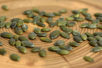 pumpkin seeds in a small wooden cup