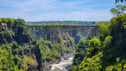 The Victoria Falls is the waterfall located on the Zambezi River between and Zimbabwe.