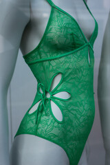 Closeup of green underwear on mannequin in a fashion store showroom - 766909598
