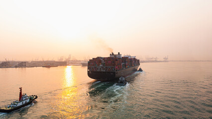 Aerial view Cargo container ship. Business logistic transpotransportation in the ocean ship carrying container,Cargo ship, Cargo container in factory harbor for import-export with copy space for text.