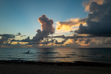 Sunset sea. Calm sea with sunset sky through the clouds over. Meditation ocean and sky background. Tranquil seascape. Horizon over the sunset sea water. Calm sea with sunset sky.