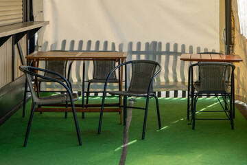 table and chairs are set up on a green carpeted area