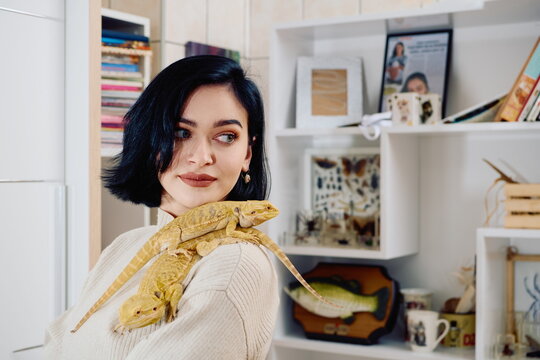 Beautiful Woman Posing with Her Two Adorable Bearded Dragon Pets