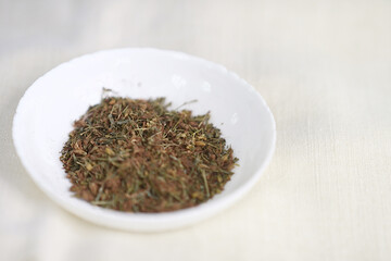 Dried Hypericum Perforatum, St. John's Wort in Bowl.