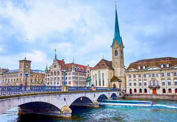 Munsterbrucke bridge that spans the Limmat River and stunning Fraumunster church, Zurich,...