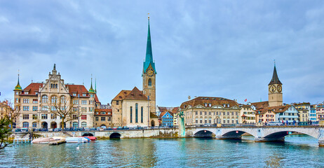 Panorama of the riverside housing of Limmat river with Peterskirche and Fraumunster churches, Zurich, Switzerland