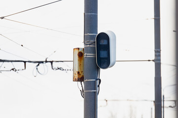 Car speed camera hooked to a communication pole