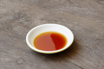 Phu Quoc Traditional Fish Sauce. Extract fish. Fish sauce in white bowl isolated.