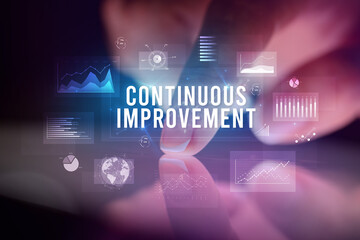 Finger touching tablet with business graphs and icons concept