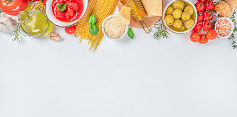 spaghetti and various ingredients for cooking pasta on a white background, Long banner format. top...