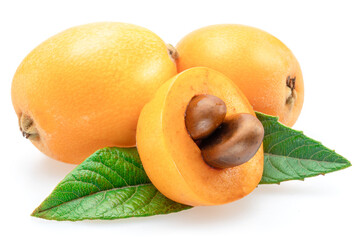 Ripe perfect loquat fruits with green leaves isolated on white background.